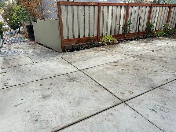 Looking down the driveway from the front door. Notice the gated driveway entrance.