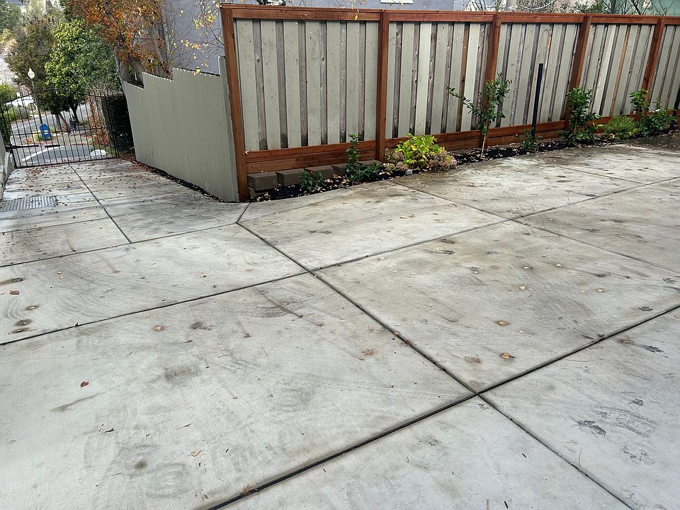 Looking down the driveway from the front door. Notice the gated driveway entrance.