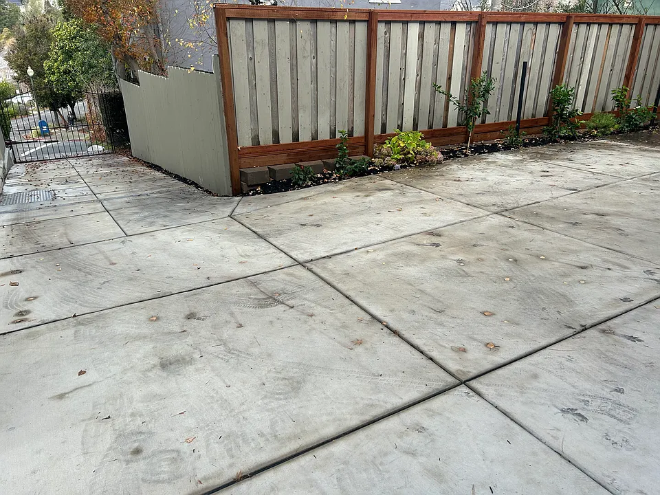 Looking down the driveway from the front door. Notice the gated driveway entrance.