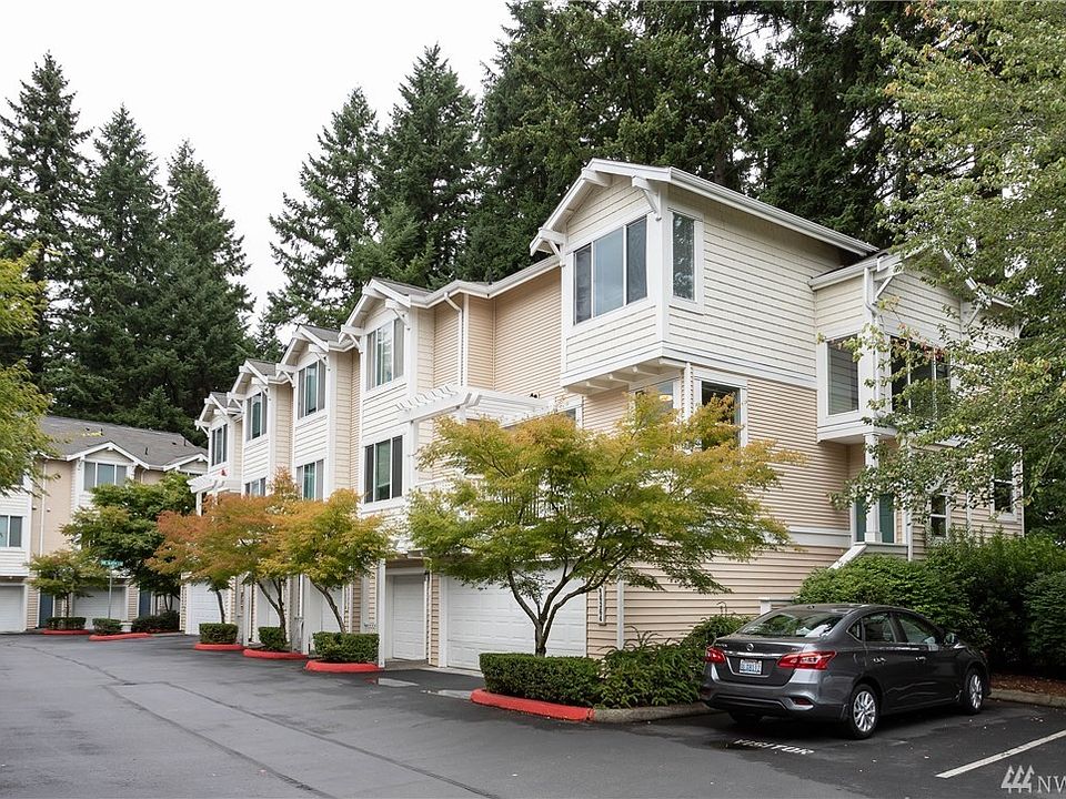 Welcome home to this light filled Cambridge Townhome that sits peacefully on the greenbelt in the back of the development. 