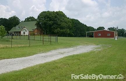 House coming up drive way
						:
						About 8 acres to back and sides of house