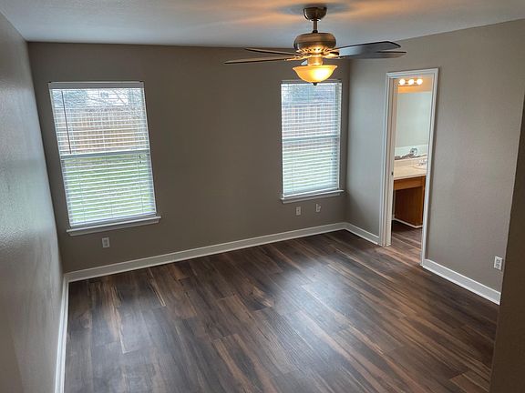 Unwind in this beautiful master suite that overlooks the backyard.