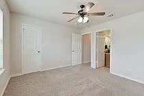 Bedroom 1 has a big walk in closet. All carpet has been replaced with wood looking vinyl plank. Ceiling fan