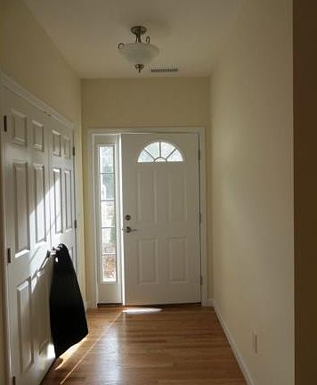 Foyer with hardwood floors ...