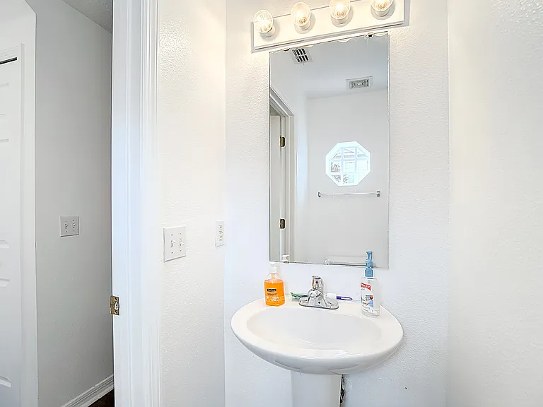 Shared downstairs half bath.