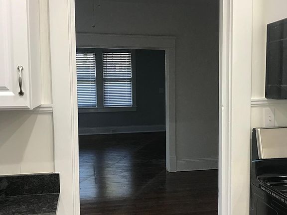 Kitchen looking through dining room to living room