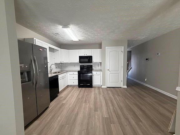 Updated kitchen with grainite countertop.