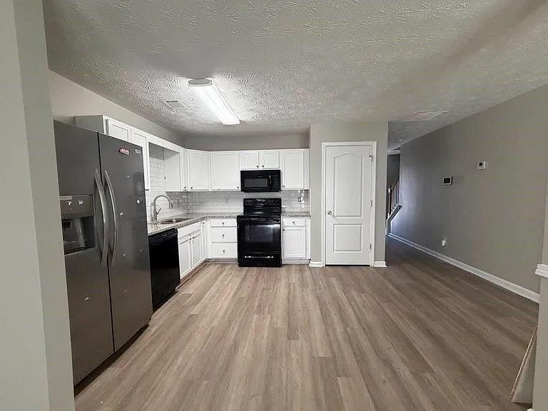 Updated kitchen with grainite countertop.