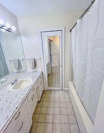 Bathroom with Tub and Shower. Walk in closet washer and dryer area .