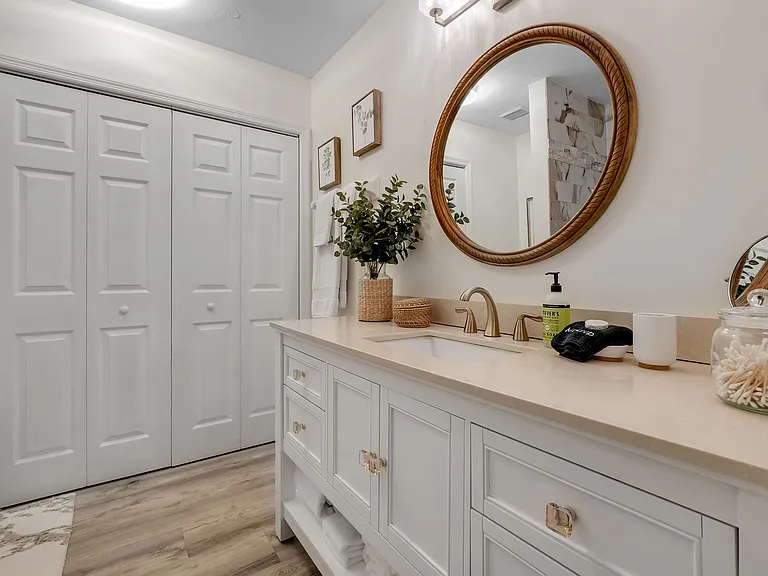Downstairs master bath - Laundry unit in closet