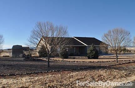 Front
						:
						full landscape, mature trees and shrubs all on drip