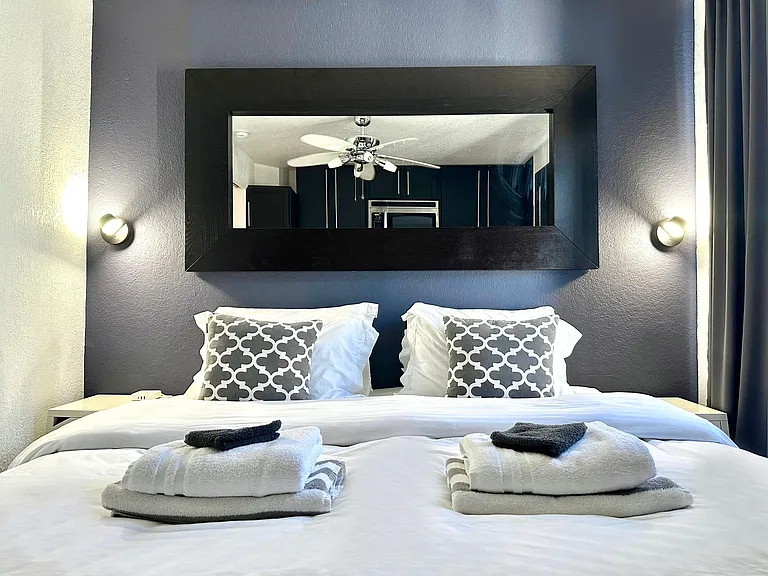 Choose between 1 King Bed or 2 Twin Beds and 1 Twin Bed for a comfortable stay.