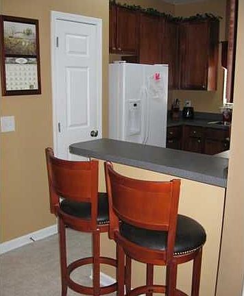 The two matching bar stools will be left for the new owner!