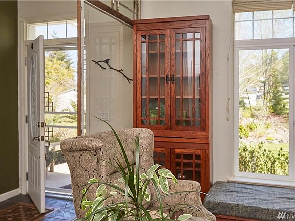 The entry is warm and bright, The entry closet is just out of sight on the left. 