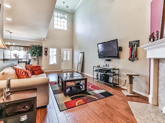 Beautifully updated townhome with wood/tile floors and open kitchen with granite countertops.