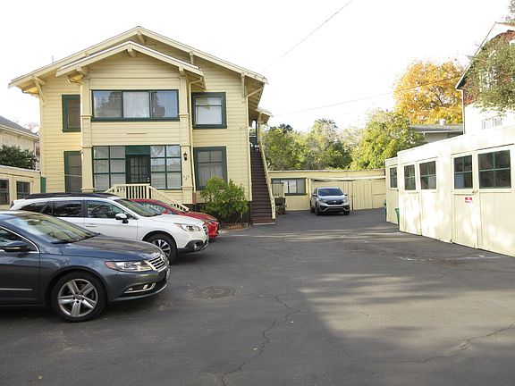 One car garage on right (for storage only) and one assigned parking space in far rear right corner space