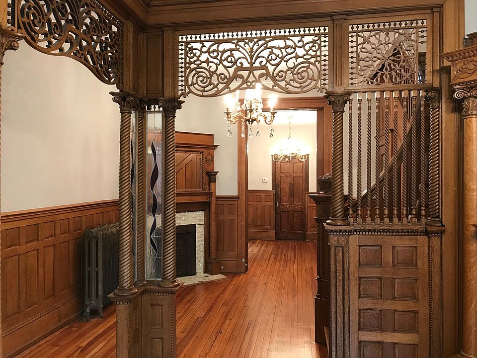 Parlor with original woodwork open to extra living space. Parlor can be used as office space.