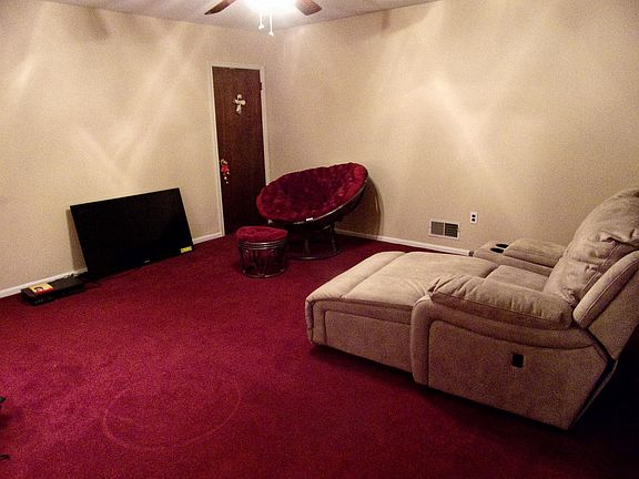 Living room with wall-to-wall carpeting