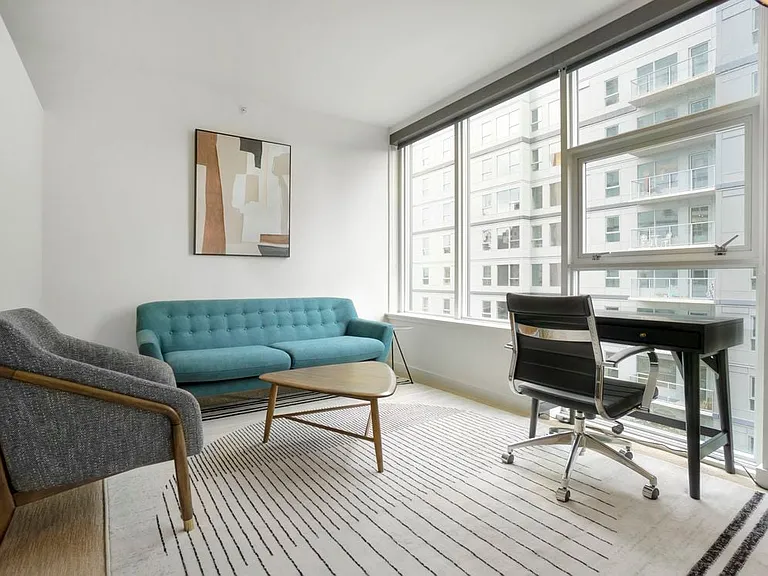 Furnished+ apartment homes come outfitted with a sofa, side chair, side table, coffee table, office desk, office chair, and TV stand and 50" Television (Representative Image exact items and style of furnishings may vary)