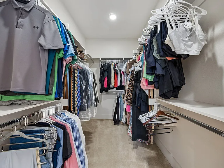 primary Closet is spacious and professionallu organized