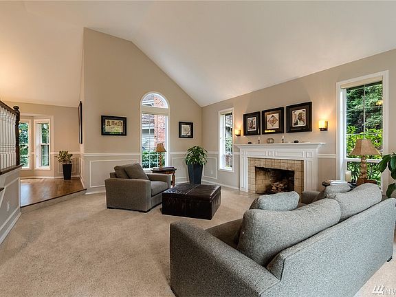 Vaulted ceilings, interesting windows and a lovely fireplace