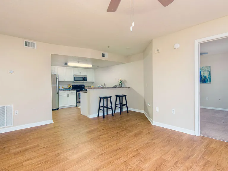 Revel in the airy openness of our floor plans accentuated by sleek wood-style flooring.