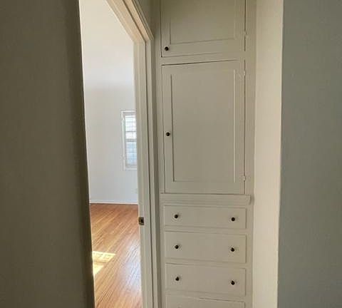 Original cabinets outside of bedroom 1