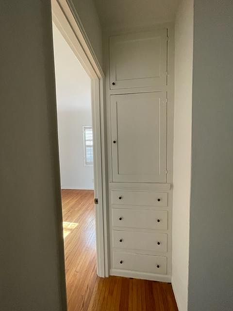 Original cabinets outside of bedroom 1