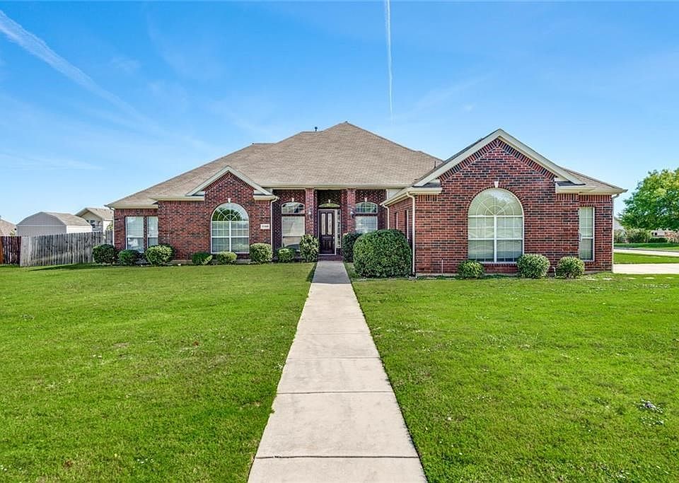 Spacious move in ready all brick one story seated on half acre corner lot in Haslet.