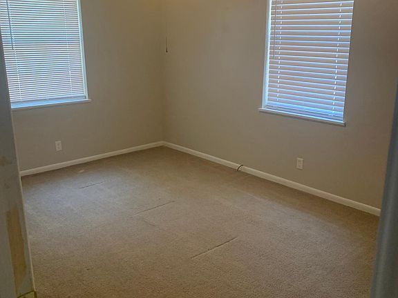 Front Corner BR - 10x15 with walk-in closet and ceiling fan.