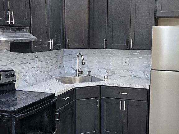 Sleek new kitchen cabinets with an 18 gauge stainless steel sink