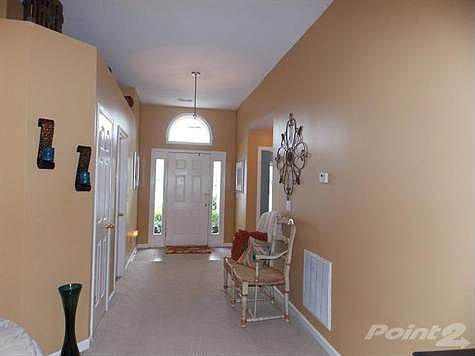 Foyer with some ceramic tiled flooring.