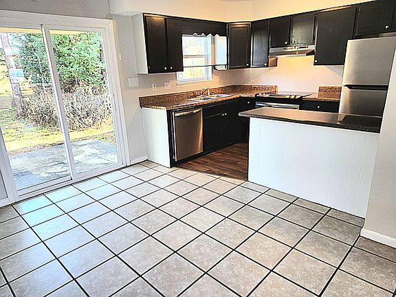Kitchen with beautiful sliding glass door and a back yard