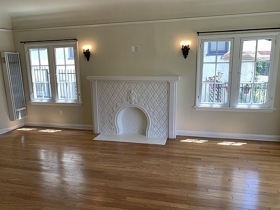 VINTAGE LIVING ROOM WITH FAUX TILE FIREPLACE