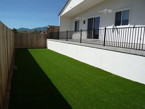 Artificial turf below back deck