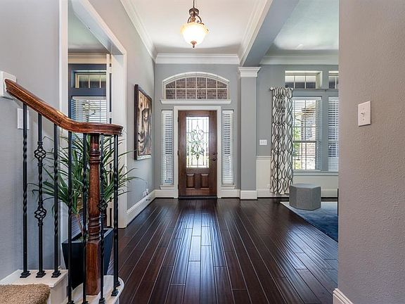 Inviting entry with hardwood floors that stretch through the entry into the dining, study & family room welcome all who enter!