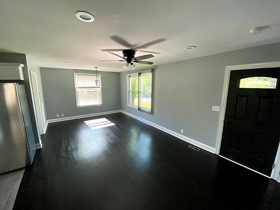 Large living room/dining room area with great views, windows come with new blinds