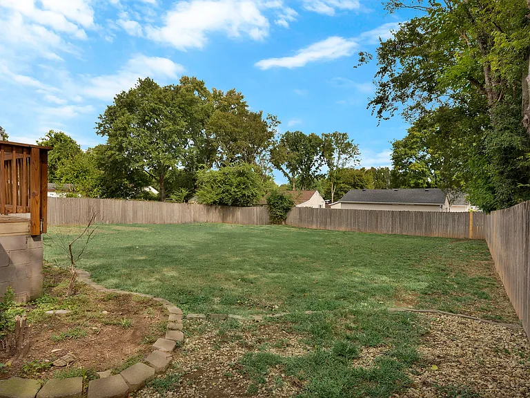 Photo 25. Portion of back deck and entry into backyard