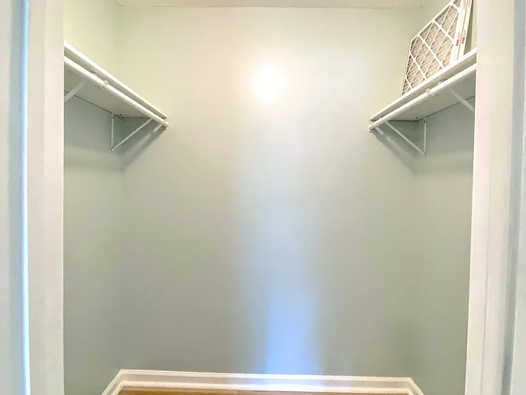Walk-in closet in main bedroom.