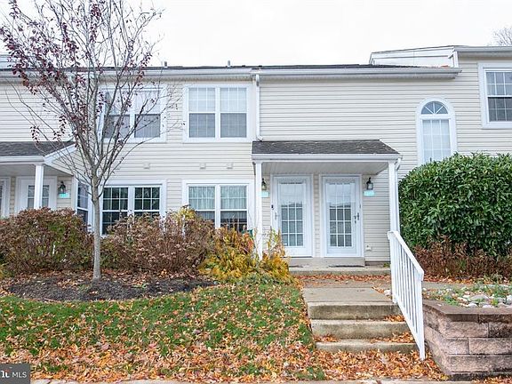 Door on the left. From parking spot