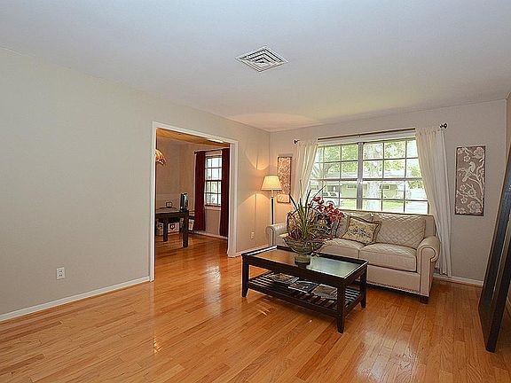 Hardwood floors cover the living room, dining room, den and kitchen.