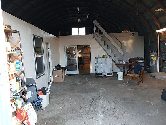 standing in building door.