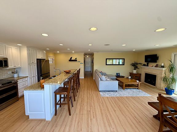 View of the great room and kitchen from the sliding glass door to the ocean side of the house