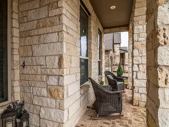 Close up of front brick patio with stonework and recessed lights