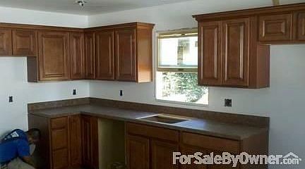 Kitchen : Brand new kitchen with room for a table and new tile floor.