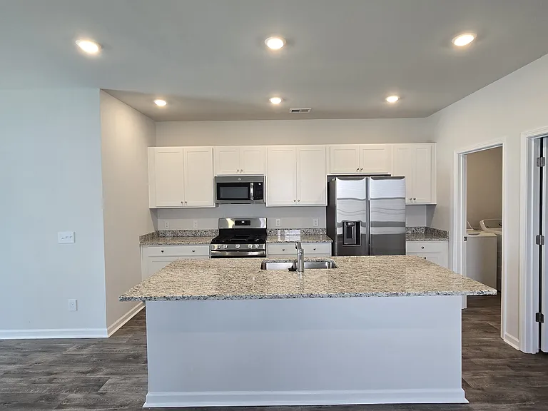 kitchen with granite countertops and stainless appliances
