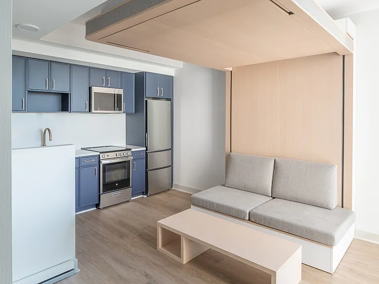 By day, the Ori Cloud Bed transforms into a cozy sofa and coffee table, maximizing the room's versatility.
