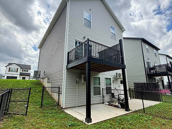 Back deck and private fenced-in backyard