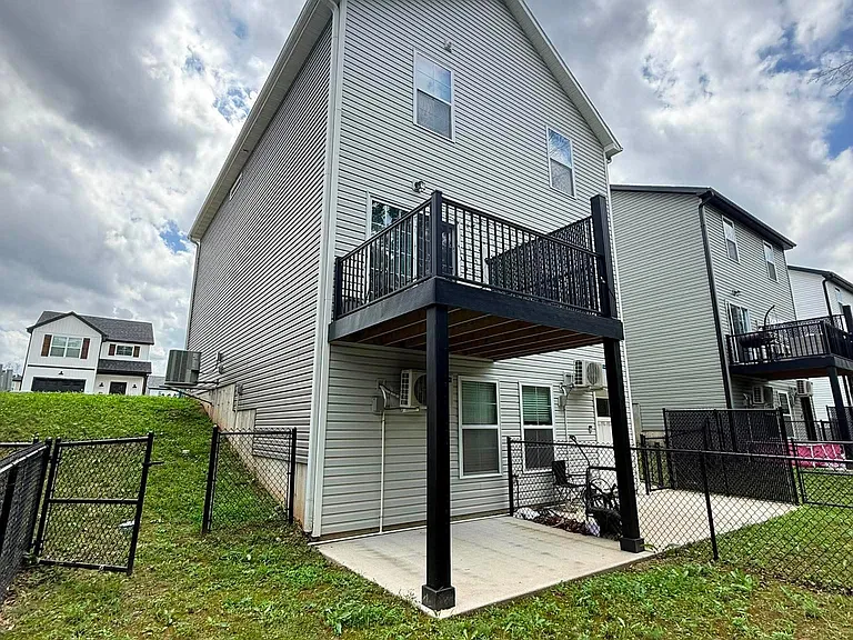 Back deck and private fenced-in backyard