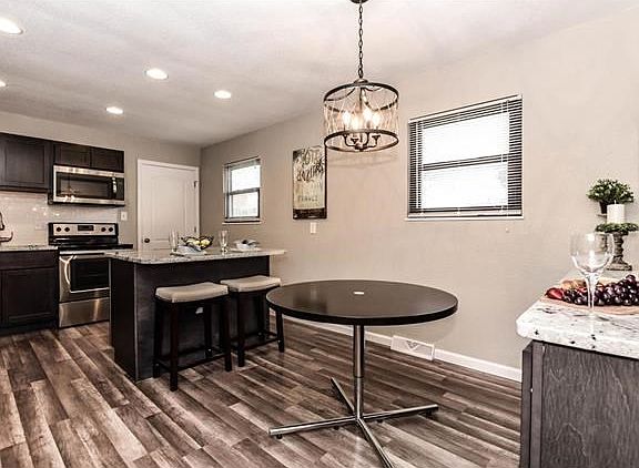 Awesome kitchen with new floors, cabinets, granite, appliances, lighting, plumbing - refrigerator included in sale!